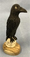 Moose antler carving of a raven on wood base 4"