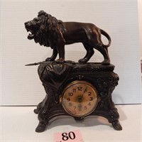 FIGURAL LION WITH SWORD CLOCK 12 X 5 X 14