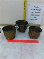 Three small brass pots