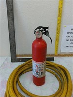 Framing square, air hose, fire extinguisher