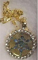 Blue Snowflake in Gold colored Pendant surrounded