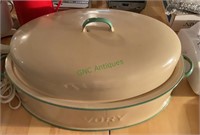 Vintage enamel roasting pan full of kitchen