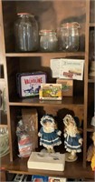 Contents of three shelves - dolls, storage