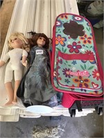 Two collectible dolls and case