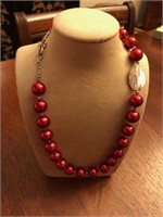 Red beaded necklace with multiple sterling silvert