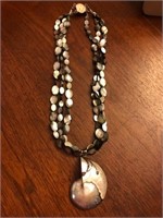 Very large shell necklace with large sterling silp
