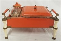 Vintage metal chaffing dish in orange