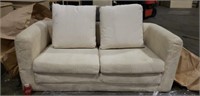 Small Cream Color Loveseat. Has some stains.