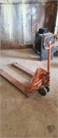 Pallet jack will work but needs oil.
