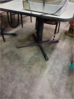 IRON LEG TABLE AND 3 BROWN CHAIRS