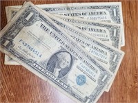 4 One Dollar Bills