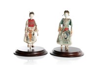 TWO CHINESE DOLLS WITH SILK EMBROIDERED CLOTHING