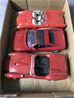 3 RED DIE CAST CARS