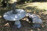 CONCRETE TABLE WITH BENCHES SHOWS DAMAGE