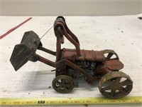 Cast iron tractor with winch loader