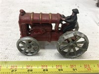 Vintage cast iron Ford tractor with driver