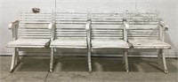 Wooden beachside bench with foldable seats.