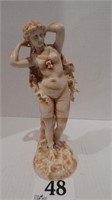 LADY FIGURINE MARKED "RW" 11 IN, BASE HAS A 1 IN