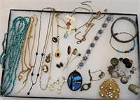 Tray jewelry includes gold filled necklace, stick