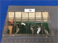 6 vintage miniature guns in display case