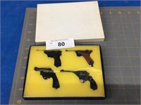 Box of 4 miniature guns