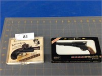 2 vintage miniature guns