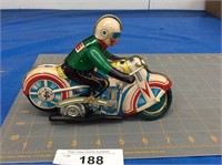 Vintage wind-up tin motorcycle toy