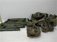 lot of military bags and straps