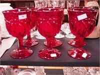 Set of six red water goblets decorated with loops