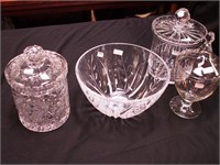 Four crystal items: two colored biscuit jars,