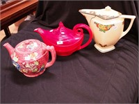 Three vintage pitchers: two are teapots,