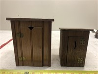 2 wood outhouses