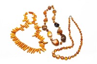 THREE AMBER BEADED NECKLACES, 113g