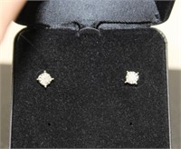 Pair of diamond solitaire earrings