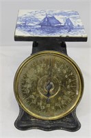 Antique scale with Delft tile