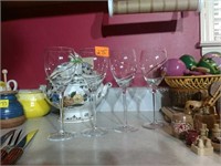 Four lovely gold trimmed wine glasses