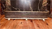 Antique brass an iron fireplace fender with