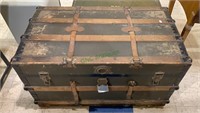 Antique flat top steamer trunk with leather and