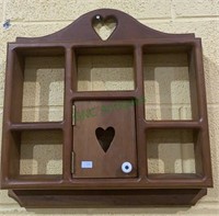 Small wood collectors cabinet with a cut out