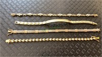 5 ladies gold tone bracelet with clear stones.