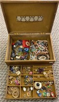 Wood jewelry box filled with costume jewelry