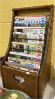 Wooden magazine rack stands 24 x 13 x 11. Has a