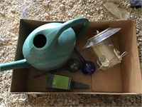 Box with watering can, bird feeder, glass