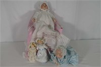 4 Porcelain Dolls In Christening Gowns
