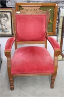 CARVED WOODEN UPHOLSTERED ARM CHAIR