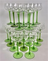 24 wine glasses, clear tops, green stems and