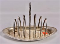 Silver "cold toast" holder, 4" x 9.5" oval base,