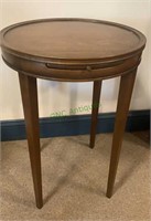 Small round side table with a pull out front