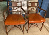 One pair of faded amber wooden office chairs