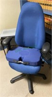 Padded roll around blue office chair with a